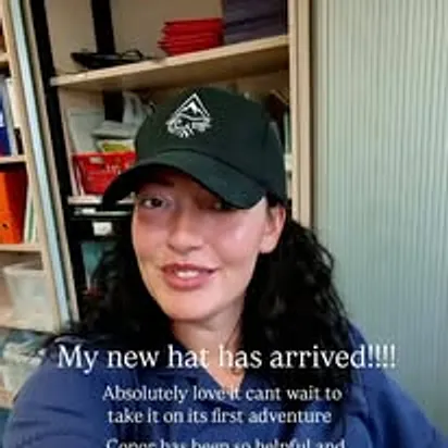 Customer review screenshot of a customer wearing a black Elements cap, captioned My new hat has arrived